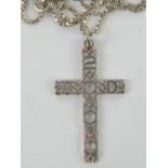 A white metal crucifix pendant having Celtic pattern with 2000 AD upon, no apparent hallmarks,