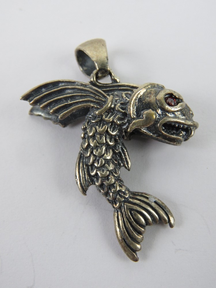 A flying fish pendant having red stone eyes, stamped 925, 4.77cm in length, 8.3g. - Image 2 of 2