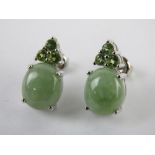 A pair of silver and green stone earrings with butterfly back stamped 925, each measuring 15 x 10mm.