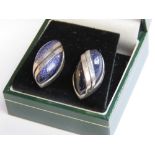 A pair of silver and blue goldstone stud earrings with butterfly backs in presentation box.
