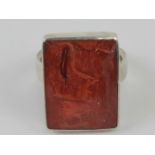 A contemporary silver and faux coral ring, stamped 925, size M.