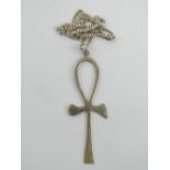 A large ankh pendant having Arabic hallmark upon, 8.2cm in length, on substantial silver chain.