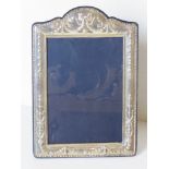 A HM silver photograph frame, 7 x 3 3/4" photo size, having velvet easel back,