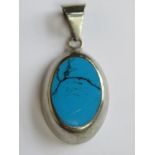 A 925 silver pendant set with turquoise and measuring 4.5cm inc bale.