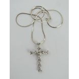A silver and CZ crucifix, stamped 925 approx 4cm in length, on silver box snake link chain.