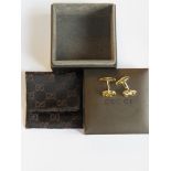A pair of gold plated cufflinks marked for Gucci Italy in presentation pouch and box.