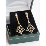 A pair of 9ct gold filigree earrings stamped 375 to post with butterfly backs in presentation box,