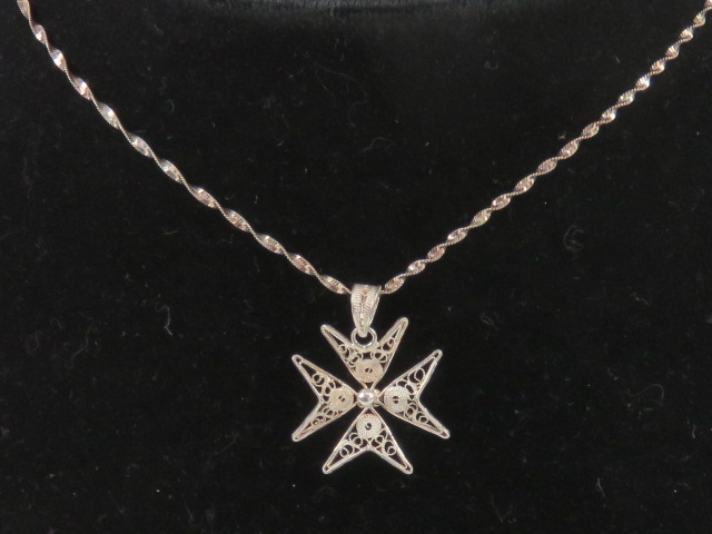 A silver filigree Maltese Cross pendant, 2.
