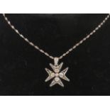 A silver filigree Maltese Cross pendant, 2.