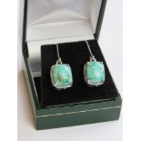 A pair of silver and turquoise earrings stamped 925 in presentation box.