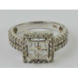 A contemporary silver and cz cluster ring, square shaped with double row band, stamped 925,