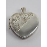 A silver heart shaped locket having unusual trinket / memory box within, stamped silver, approx 2.