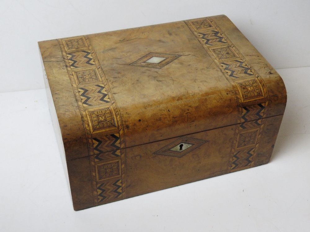 An antique walnut stationery box having inlaid mother of pearl and boxwood to front and lid