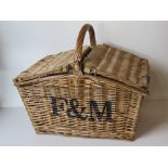 A Fortnum & Mason wicker picnic basket having loop handle over, approx 51 x 36 x 46cm.