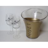 A Moet & Chandon champagne cooler with pair of glasses.