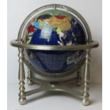 A semi-precious gemstone globe having compass to chromed metal base,