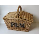 A Fortnum & Mason wicker picnic basket having loop handle over, approx 51 x 36 x 46cm.