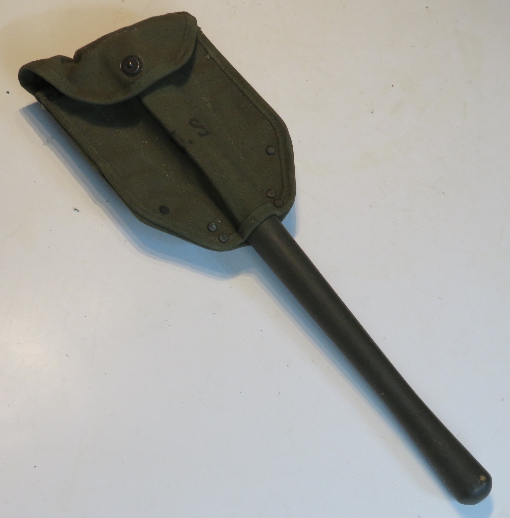 A reproduction US shovel and pouch.