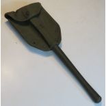 A reproduction US shovel and pouch.