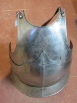 Decorative armour plate with straps.