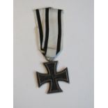 A reproduction WWI German Iron Cross wit