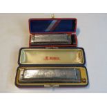 Two Harmonicas. One being 64 Chrominca b