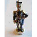 A hand painted German porcelain figurine