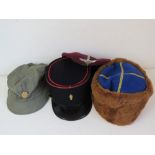 A Soviet Army brown/blue kubanka hat, a