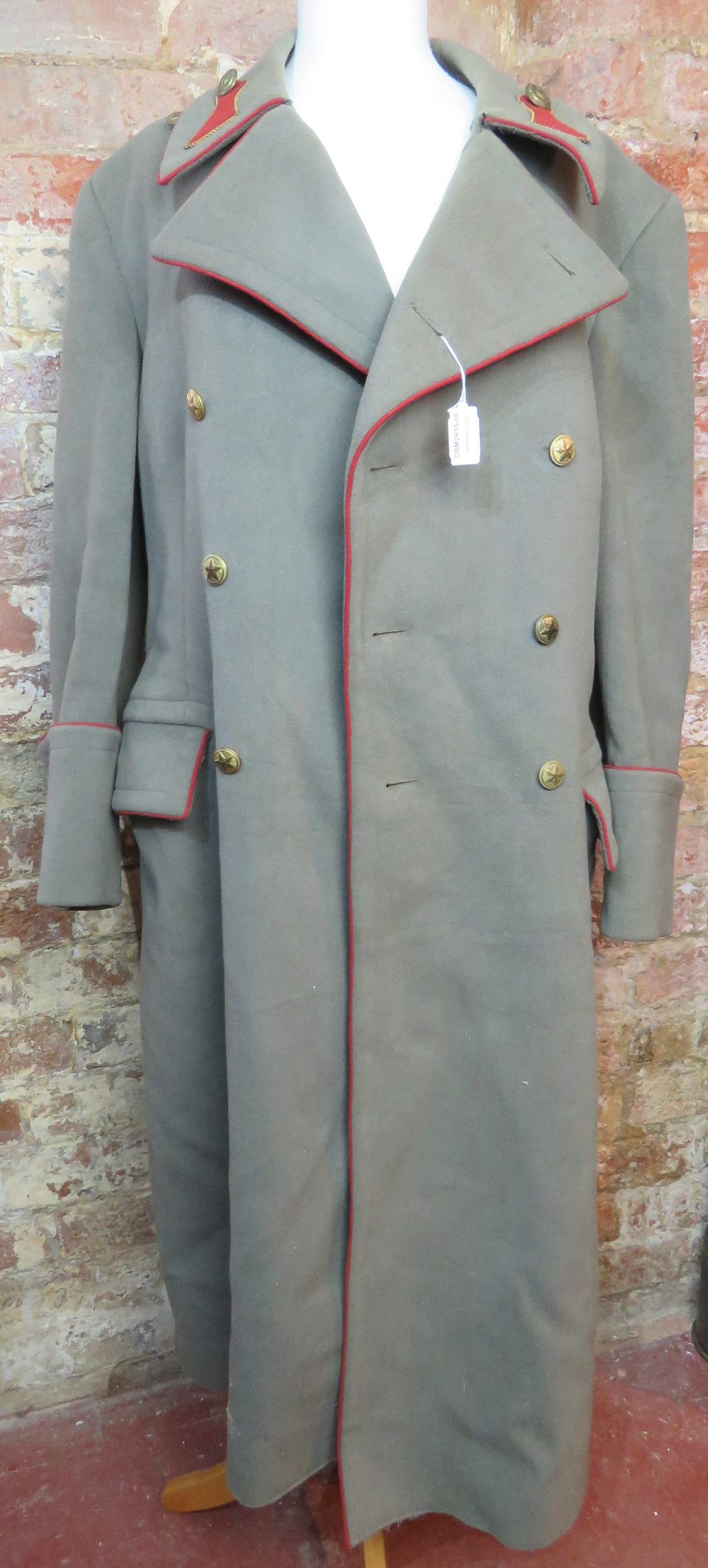 A Russian Great Coat complete with butto