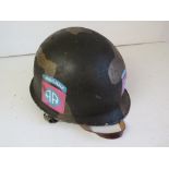 A US M1 helmet with Airborne decals eith