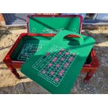 A late 20th century gaming coffee table having three baises including roulette wheel,