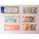 A collection of assorted world paper bank notes including; Peru, Oman, Slovenia, Italy, Guernsey,