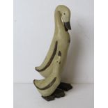 A contemporary duck and duckling figurine.