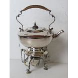 A delightful silver plated picnic teapot having hinged removable stand with spirit burner under.