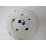 An antique white ground plate having blue floral design upon featuring insect and butterfly,