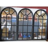 A set of three black framed arch top window effect mirrors.