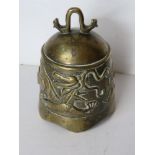 An Oriental brass bell shaped cloche having dragon design upon, measuring approx 11.5cm dia.