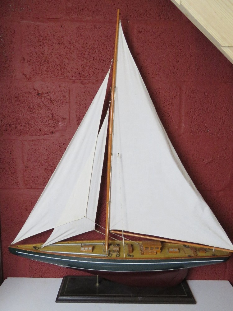 A large model of a pond boat on stand me