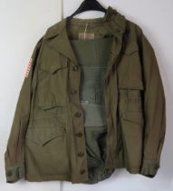 A WWII US M-1943 Airborne jacket and Air
