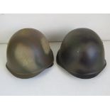 Two Russian helmets, both with German Li