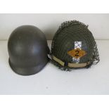 Two US M1 helmets, one with liner, one h