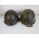 Two Russian helmets, one with original l