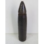 An inert WWII German 7.5cm le.IG 18 shel