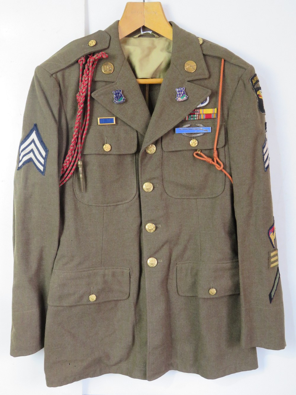 A WWII US Airborne tunic, having all but