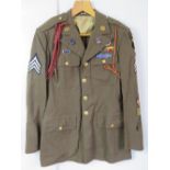 A WWII US Airborne tunic, having all but
