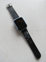 An unknown brand smart watch on blue and