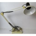 A vintage white angle poise type lamp ha