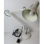 A white metal angle poise type desk lamp