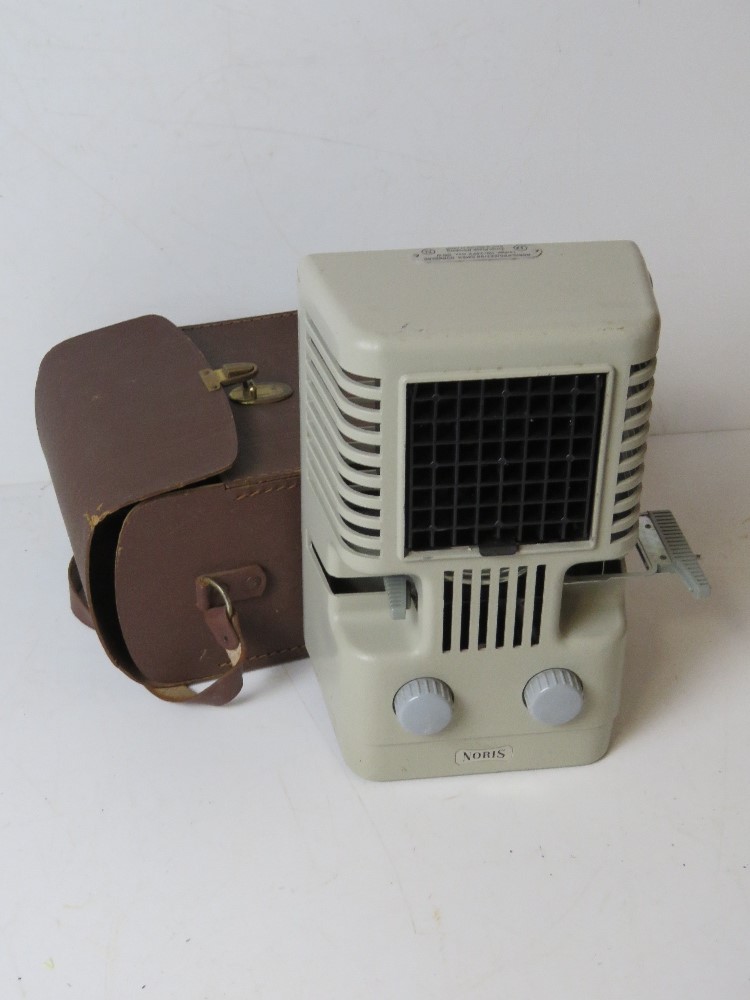 A Noris slide projector in original case