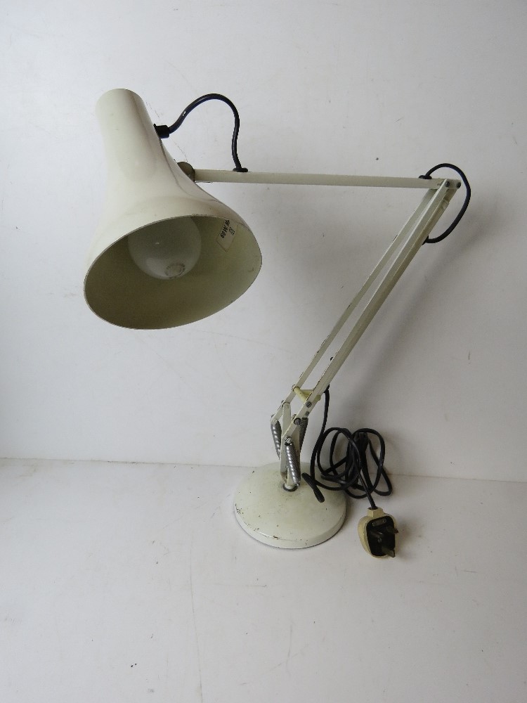 A white metal angle poise style table lamp.